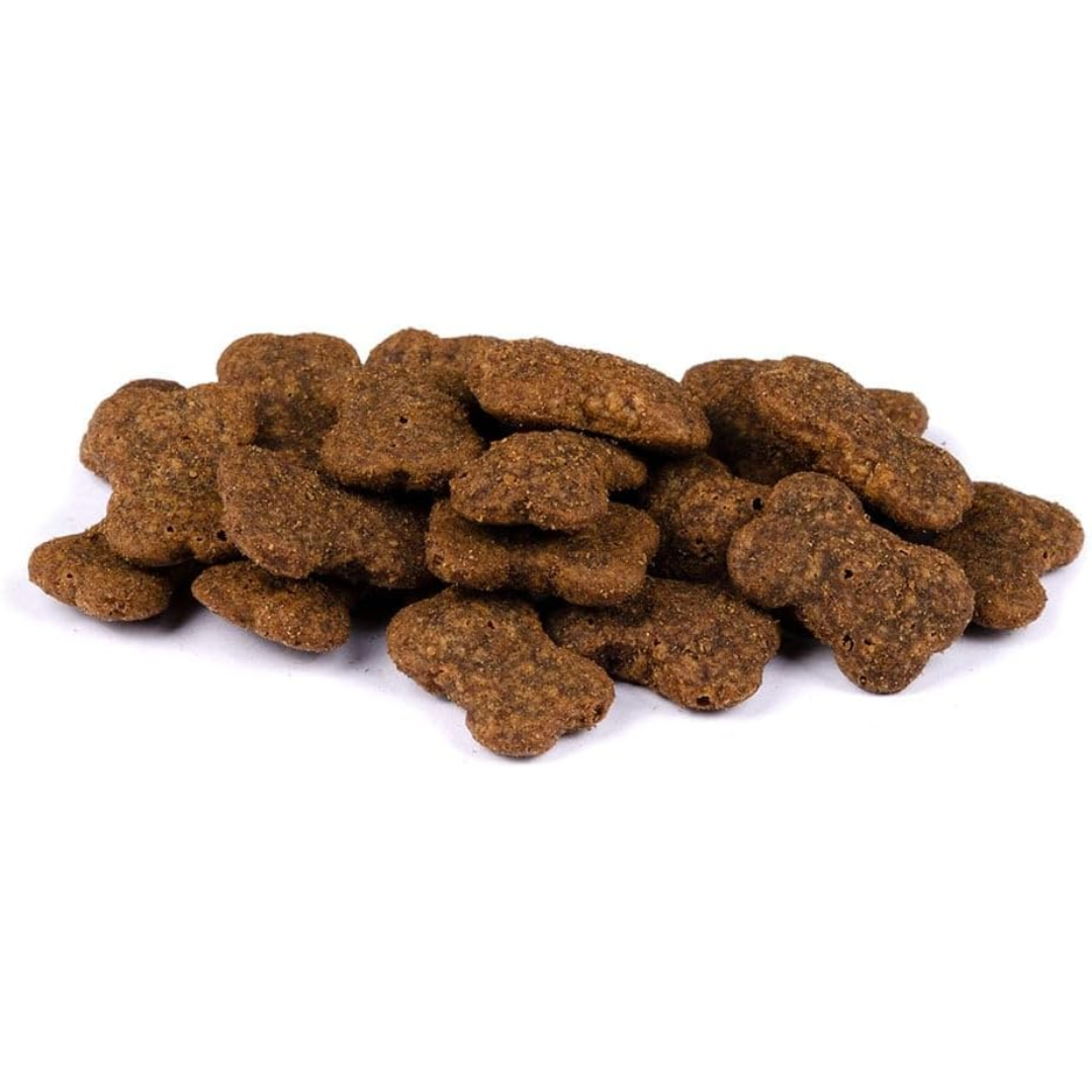 The Carnilove Ostrich with Blackberries Crunchy Dog Treats. There is a pile of loose treats against a white background. They are shaped as bones.