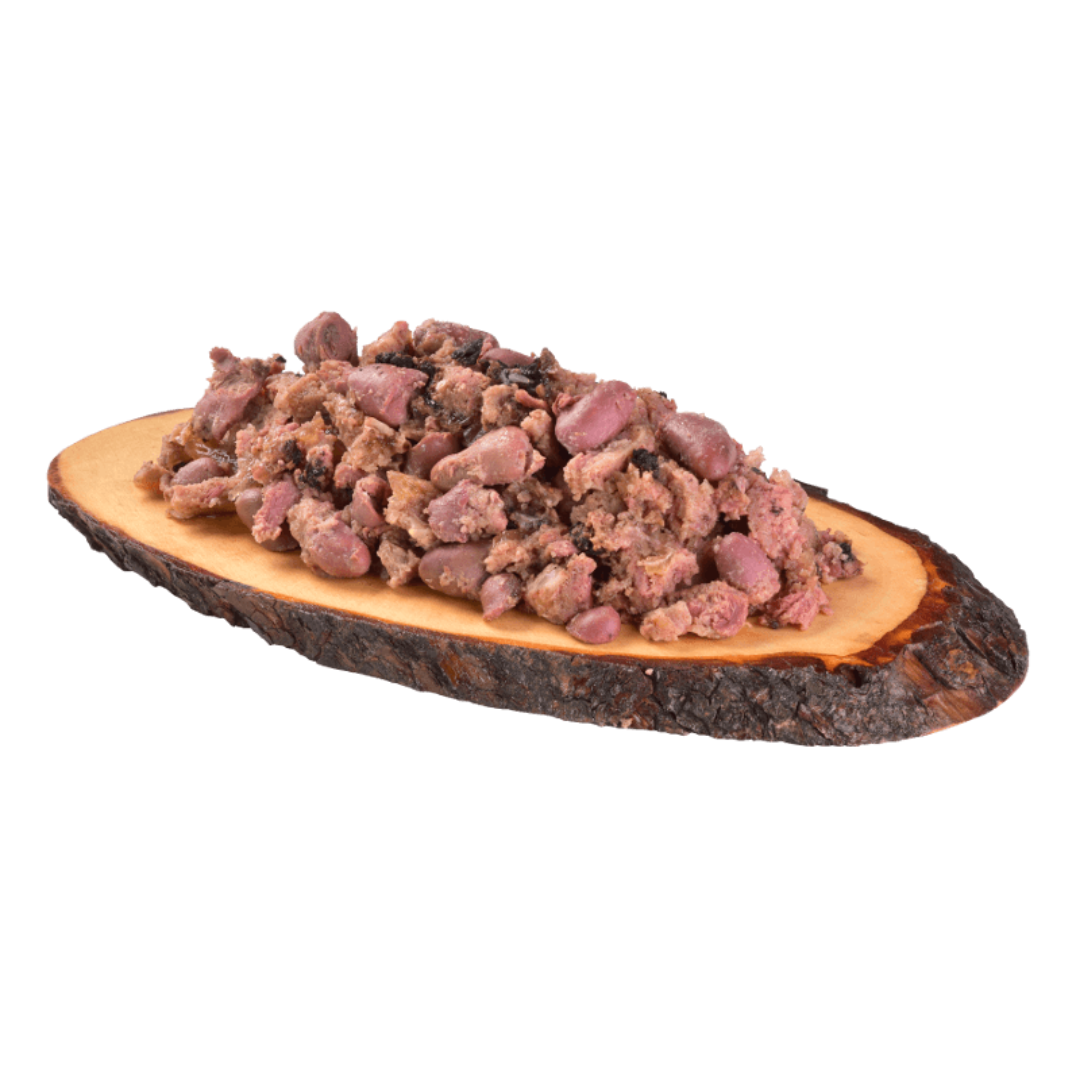 The Carnilove duck& pheasant wet dog food served on a wooden dish has a chunky consistency with many different textures throughout.