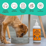 Dog eating from a bowl beside a bottle of natural dog company wild alaskan salmon oil