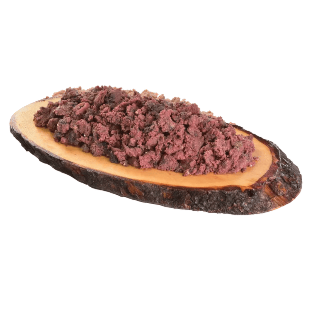 The Carnilove Buffalo with Rose Petals wet dog food served on a wooden dish has a chunky consistency with many different textures throughout.