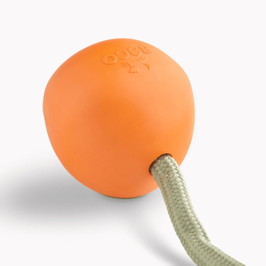 Close up of the Beco Orange Rubber Slinger Ball