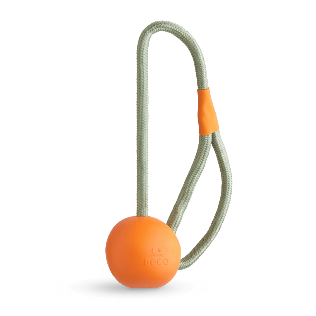 the Beco Orange Rubber Slinger Ball against a white background