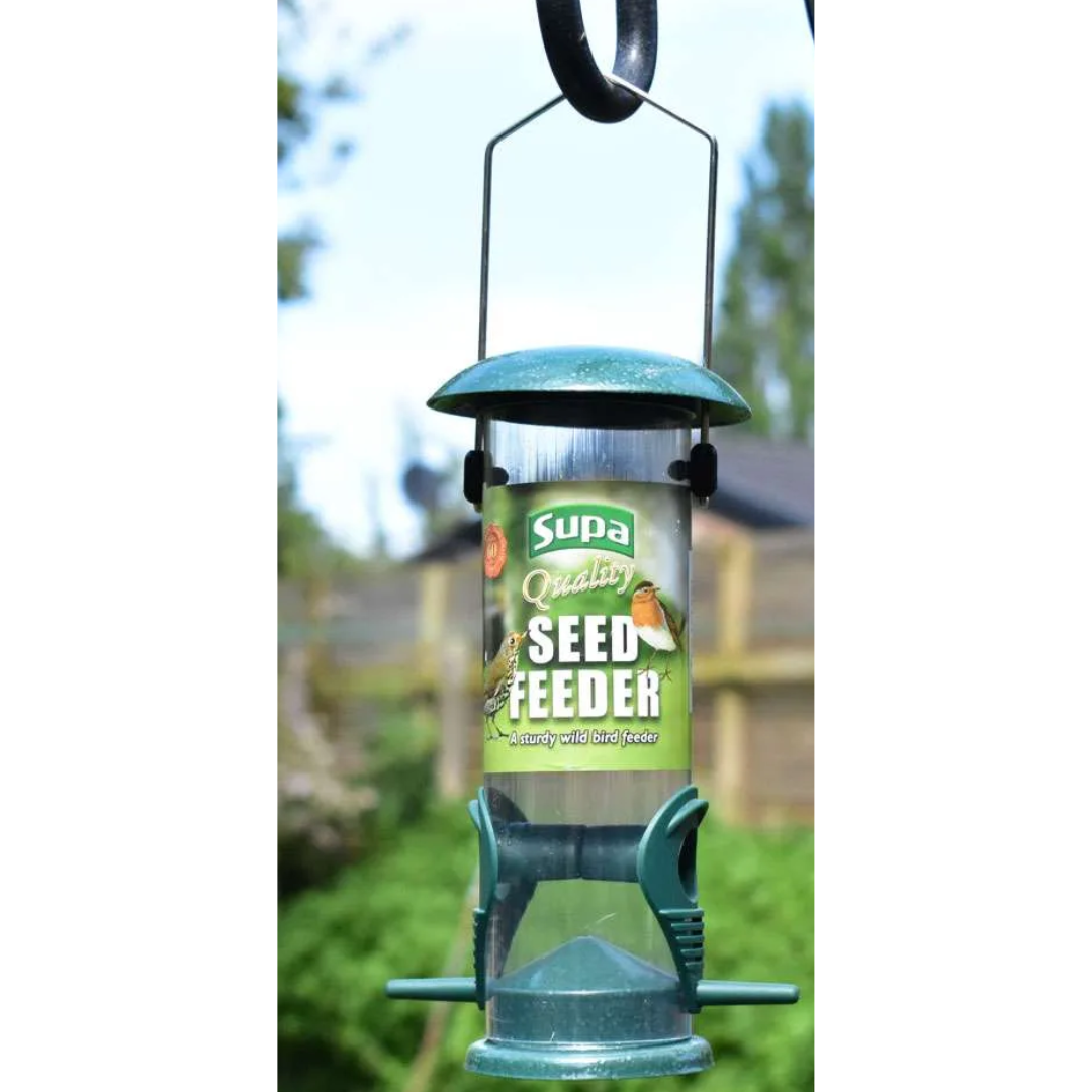 Supa Seed Feeder with green label against a blurred outdoor background