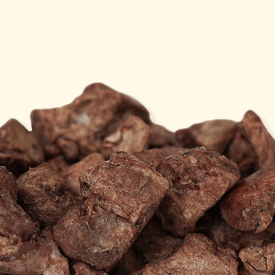 Close-up of brown duck pieces on a beige background