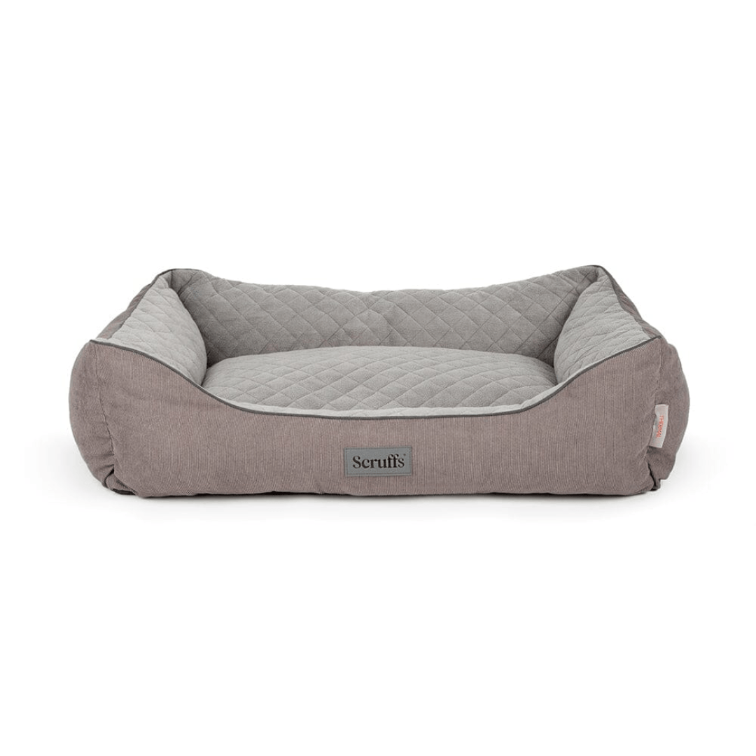 Grey pet bed with quilted design on a white background