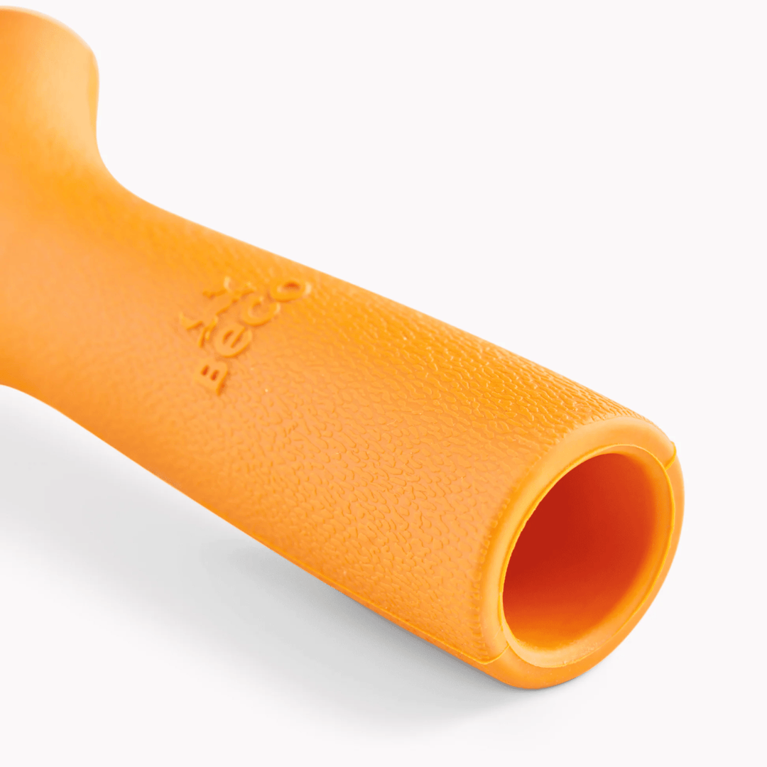Up close of the opening on the bottom of Beco Orange Rubber stick.
