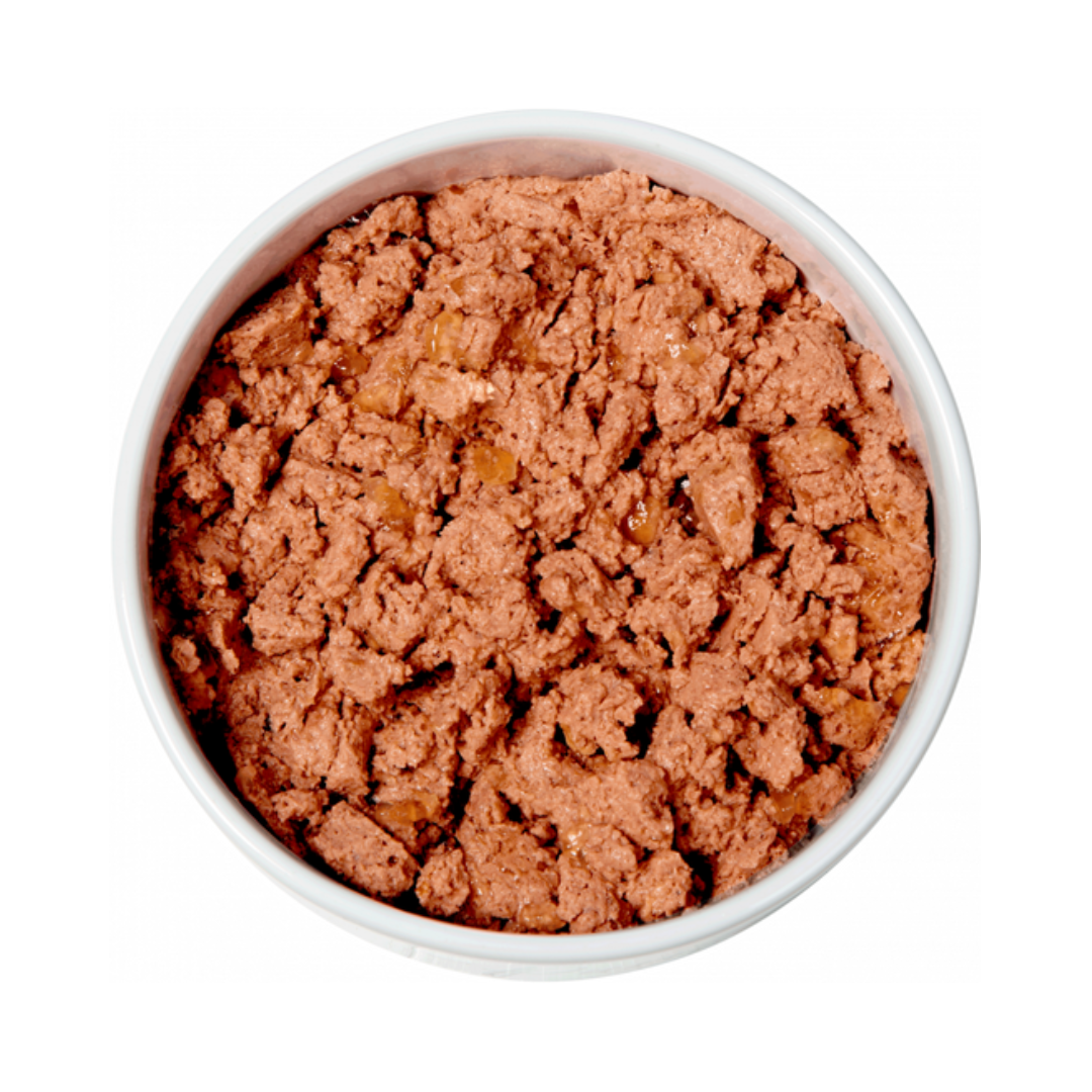 White ceramic bowl filled with Natures Menu Chicken with Turkey wet food for cats.