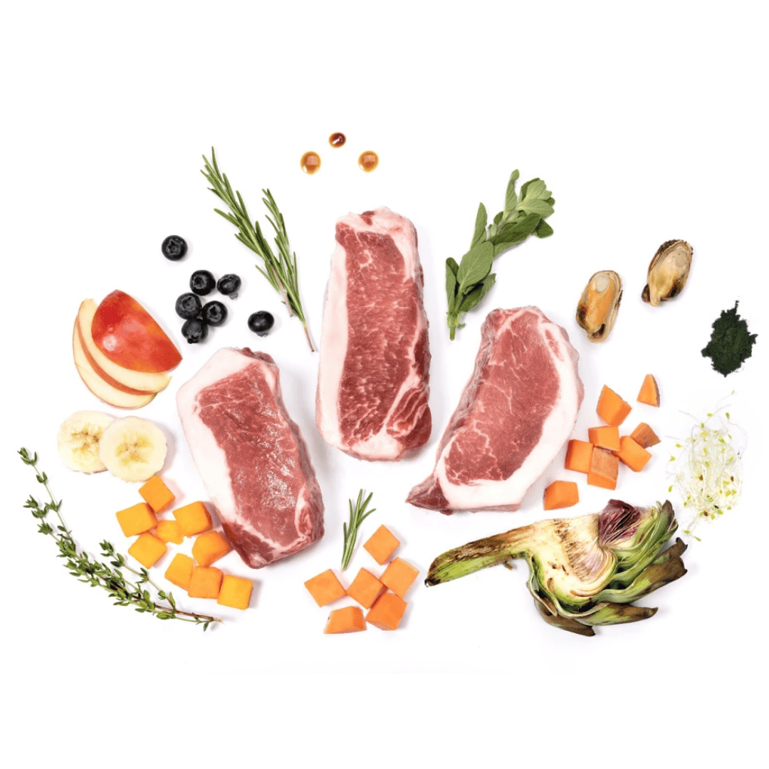 Raw ingredients of Ydolo pork semi moist dog food including artichoke, apples and spirulina.