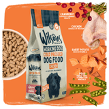 A bag of Wisons Working Dog Cold Pressed Dog Food, Chicken flavor, displayed alongside ingredient callouts for cranberry, chicken, sweet potato, and peas on an orange background.