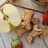 Happy Tails Barkery Apple Pie Dog Treats with some fresh ingredients on display.