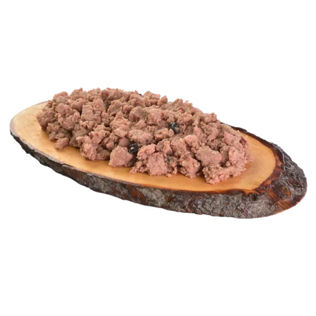 The Carnilove Ostrich with Blackberries wet dog food served on a wooden dish has a chunky consistency with different textures throughout.