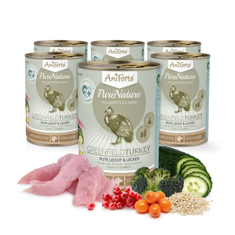 Six tins of AniForte Turkey Wet Food with raw ingredients in the foreground