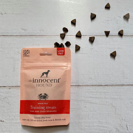 Bag of Innocent Hound Training Treats Tuna and Crab Rewards with the treats coming out of the top of the bag.