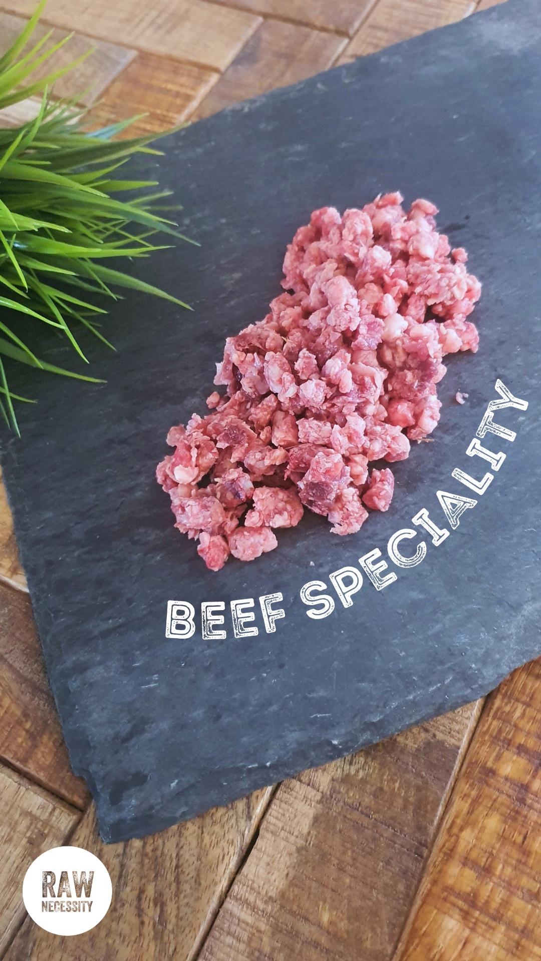 Raw Necessity Boneless Beef Speciality on a piece of slate.