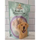 A backet of Bananas About Butter Happy Tails Barkery Dog Treats on a counter top