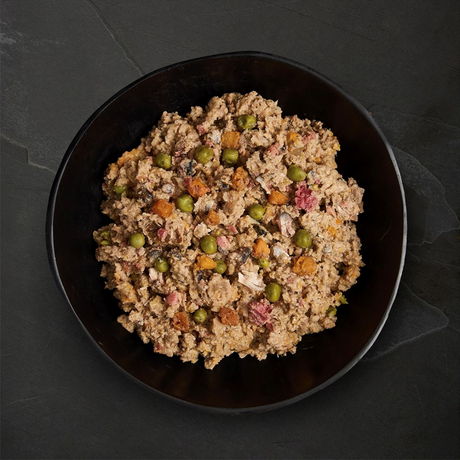 Canagan Salmon and Herring Supper Wet Food 400g served in a bowl. Chunky, mince like texture with vegetables.