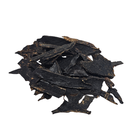 Stack of dried beef liver pieces on a white background