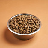 Stainless steel bowl full of Darf Cold Pressed North Sea Fish dog food.