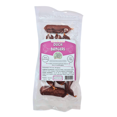A package of Duck Bangers dog treats in a clear plastic bag with a pink and white label, shown against a plain white background.