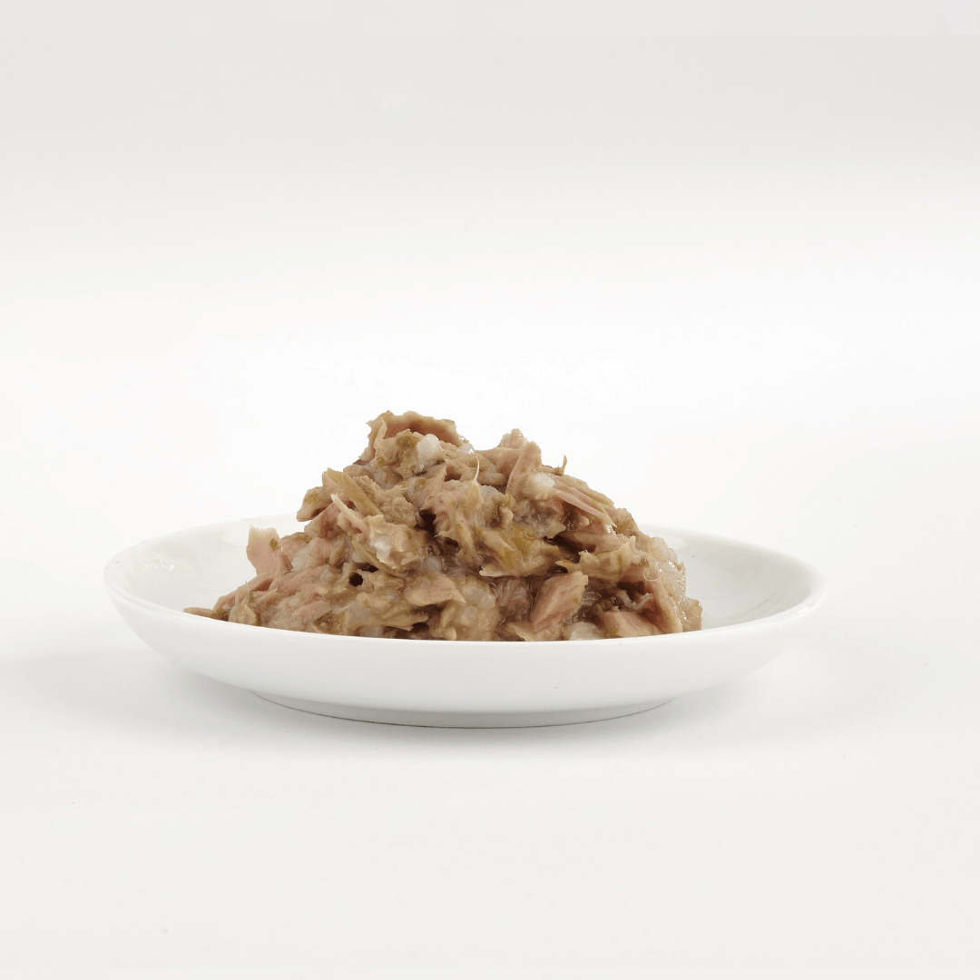 White bowl with a serving of Fish 4 Cats Tuna with Seaweed wet food on a white background