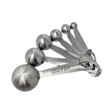Set of silver measuring spoons with 'Atlas & Tail' branding on a white background