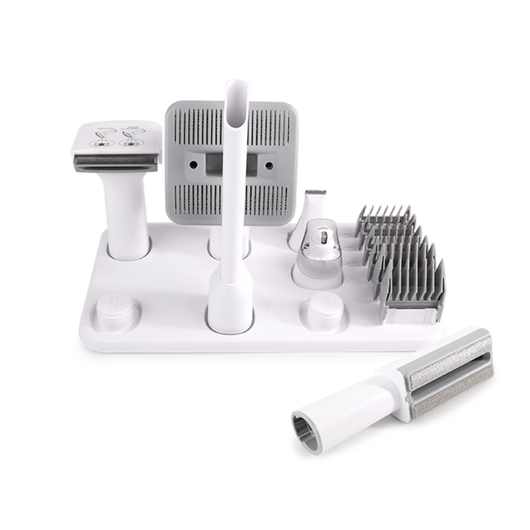 Set of grooming tools for pets on a white background