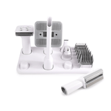 Set of grooming tools for pets on a white background