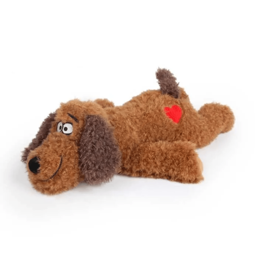 Brown dog-shaped plush toy with a red heart on a white background