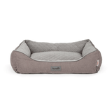 Grey pet bed with quilted design on a white background