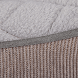 Close-up of textured fabric with a focus on pattern and color.