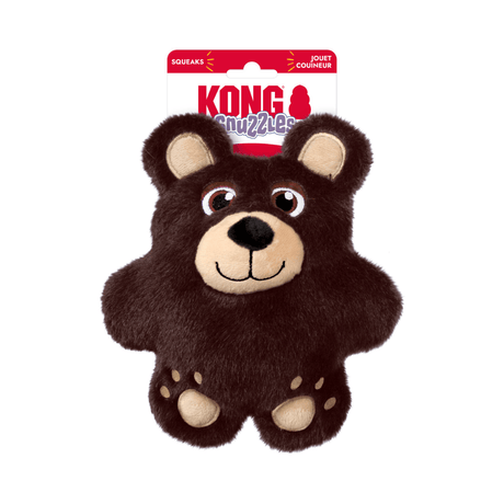 A brown plush Kong Snuzzles bear dog toy with beige facial features and paws, attached to a red and white KONG brand hang card, on a plain white background.