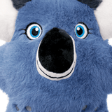 Close-up of a blue kong koala plush toy face with large blue eyes, a black nose, white stitched smile, and white inner ears on a white background.