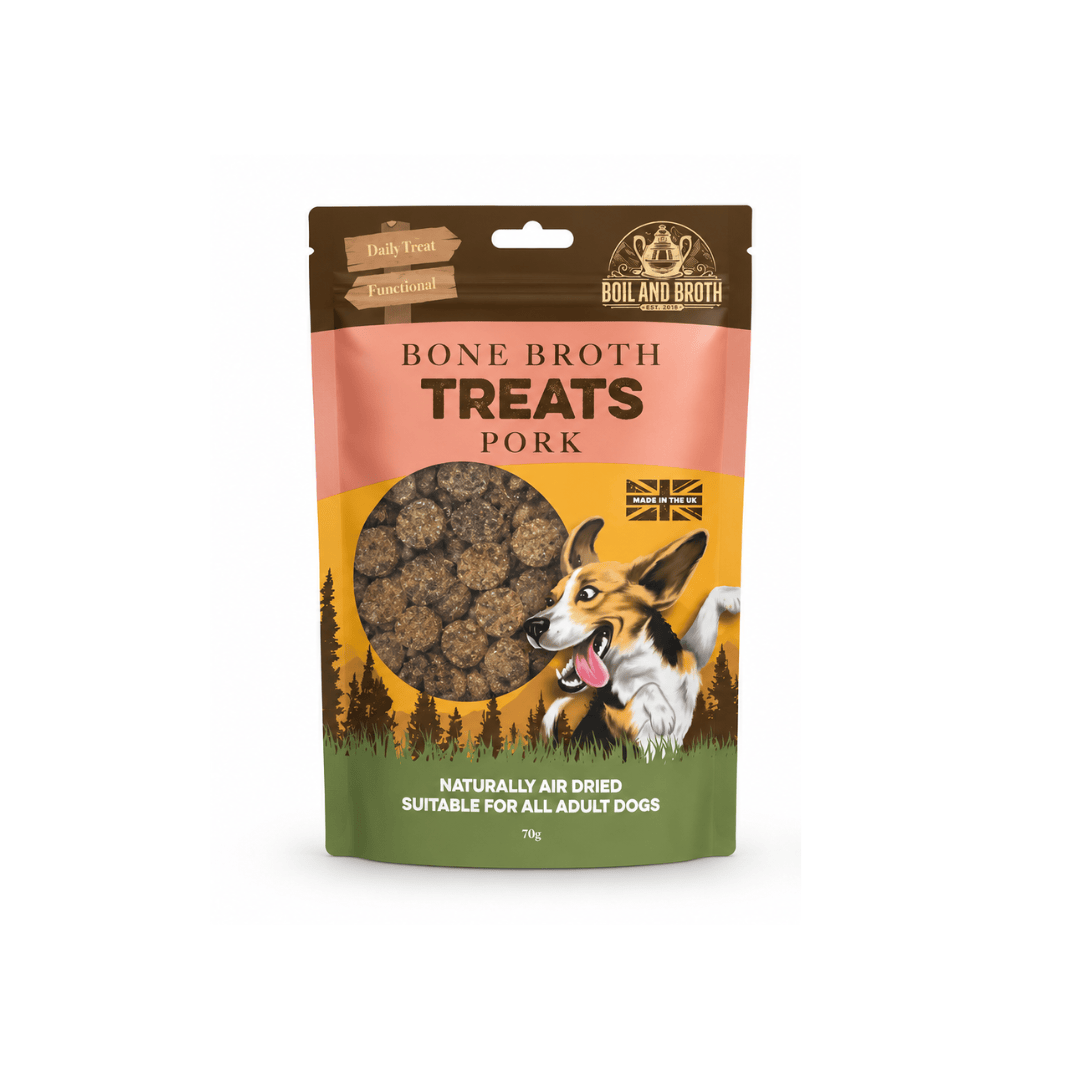 A 70g stand-up pouch of Boil and Broth Bone Broth Treats Pork for adult dogs, featuring a Corgi illustration and a clear window showing round chopped sausages shaped treats inside.