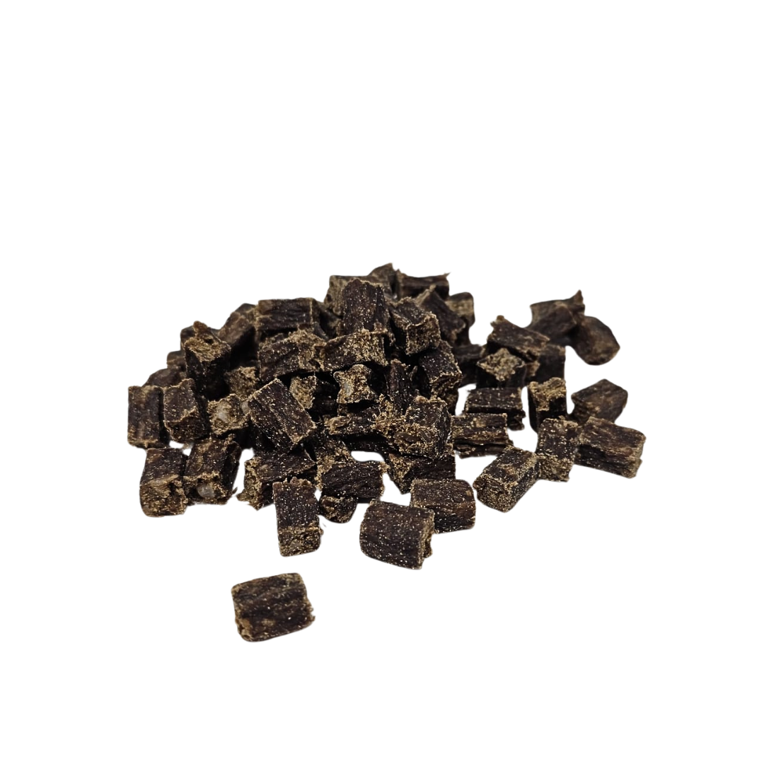 Pile of venison cubes on a white background