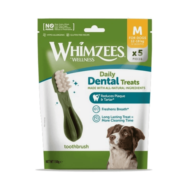 Whimzees Wellness Daily Dental Treats for dogs in a green and white resealable pouch, featuring a toothbrush graphic and a brown and white dog photo, with 'M' size indicated for dogs 12-30 kg.