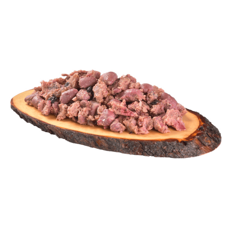 The Carnilove Salmon & Turkey wet puppy food served on a wooden dish has a chunky consistency with many different textures throughout.