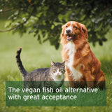 Dog and cat sitting together in a grassy area with text about vegan fish oil alternative.