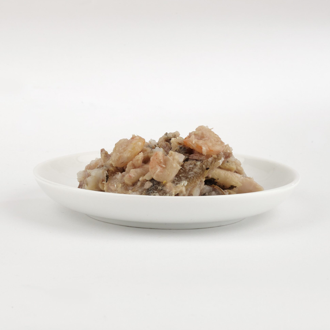 The  Fish 4 Cats Sardine & Shrimp cat food served on a plate with a soft, fish consistency