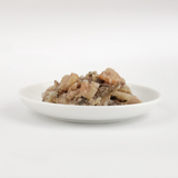 The  Fish 4 Cats Sardine & Shrimp cat food served on a plate with a soft, fish consistency