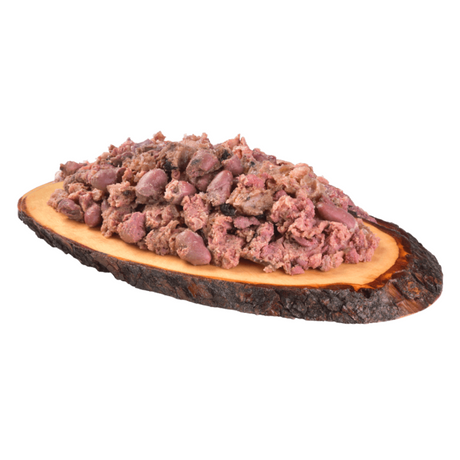 The carnilove salmon an turkey  wet dog food served on a wooden dish has a chunky consistency with many different textures throughout.