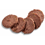 Country Hunter Salmon & Chicken Dog Food Tin, the product has been removed from the packaging. It is chopped up into slices. You can see a meaty food with jelly like sections, and chunks of veg.