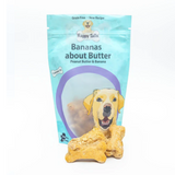 Bananas About Butter Happy Tails Barkery Dog Treats, there is a full packet and some loose biscuits.