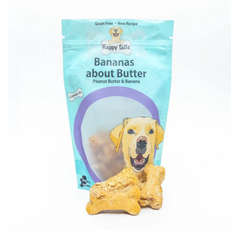 Bananas About Butter Happy Tails Barkery Dog Treats, there is a full packet and some loose biscuits.